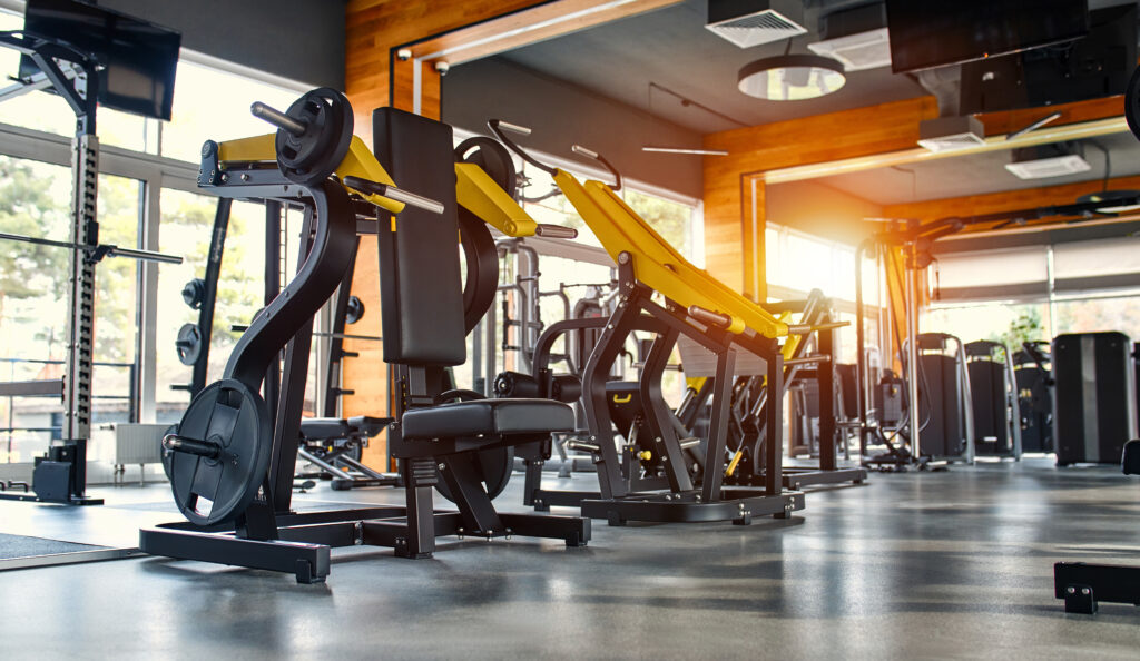 Within gym with modern fitness equipment for fitness events and more. Modern of gym interior with equipment. Sports equipment in the gym.